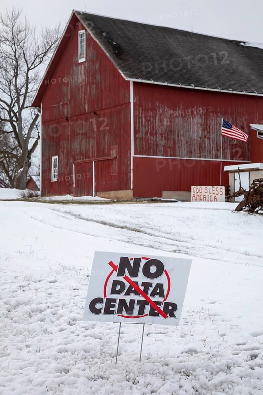 Saline, Michigan USA - 1 December 2025 - A sign on a rural Michigan road opposes a planned $7 billion data center on southeast Michigan farm land. Opponents say the Data Center could raise residential electricity rates and endanger the water supply