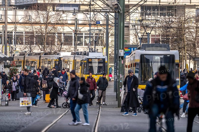 Trams at Alexanderplatz in Berlin, passers-by, Germany