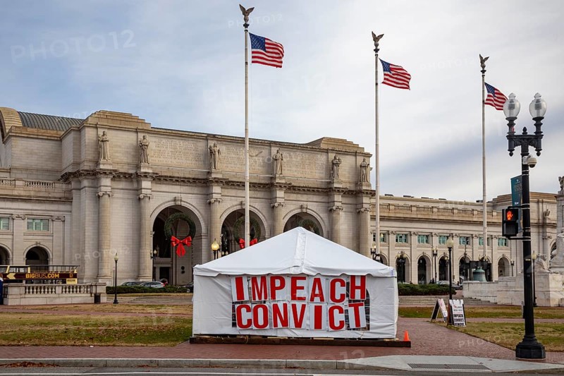 Washington, DC - A large sign outside Union Station calls for impeachment and conviction