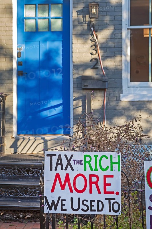 Washington, DC - Signs outside a home on Capitol Hill opposing Trump Administration policies