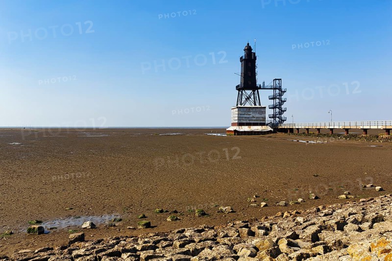 Historic lighthouse Obereversand im Wadden Sea, iron tower with black lantern, landmark, Dorum-Neufeld, Wurster North Sea coast near Cuxhaven, Lower Saxony, Germany