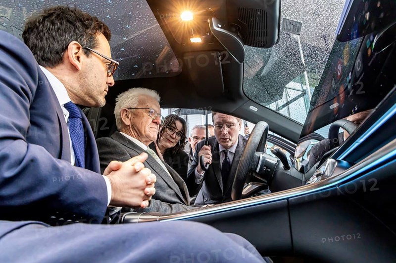 Annual event on the BW Automotive Industry Strategy Dialogue (SDA) in Stuttgart. Winfried Kretschmann, (Greens, Minister-President BW) and Ola KÃ¤llenius (CEO of Mercedes-Benz Group AG) in the Mercedes GLC 400. In the foreground Stéphane Séjourné (Executive Vice President of the European Commission and Commissioner for Prosperity and Industrial Strategy) . Automotive industry conference. Stuttgart, Baden-WÃ¼rttemberg, Germany