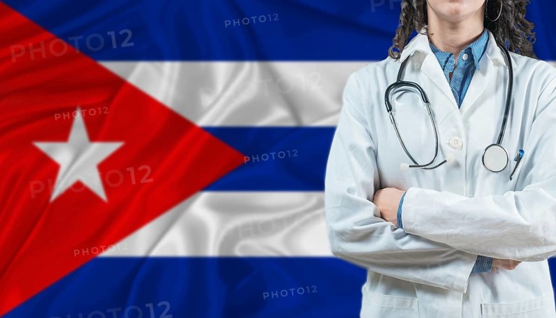 Medical professional on Cuba flag. Healthcare and wellness in Cuba, Concept