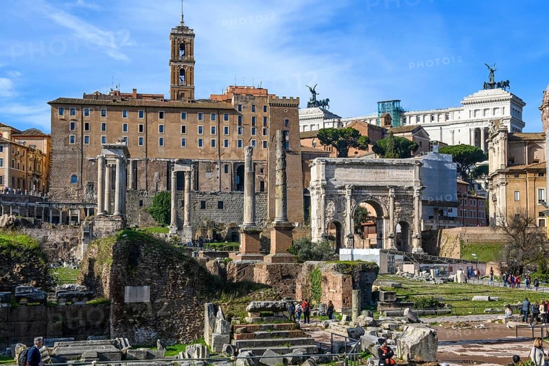 View of Roman Forum on left back ancient administrative building of Rome building from tabularium on capitol hill, right in the background Altare della Patria, in front right triumphal arch of Severus, in the foreground ruins remains pillars of ancient temples, Roman Forum, Rome, Lazio, Italy