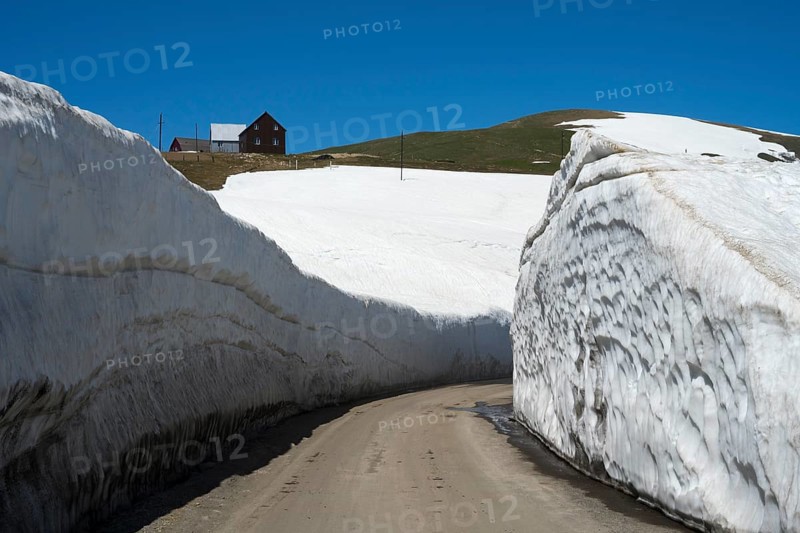 A narrow path through high snow walls in a wintry mountain landscape, Goderdzi Pass, Ajara region, Adjara, autonomous republic, Georgia