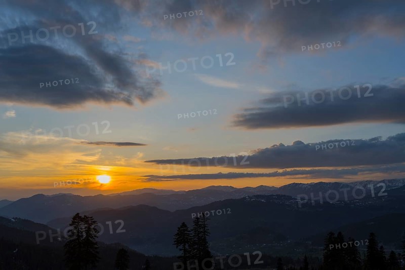 A romantic sunset over mountains with colorful sky and clouds, view from Goderdzi Pass, Ajara region, Adjara, autonomous republic, Georgia
