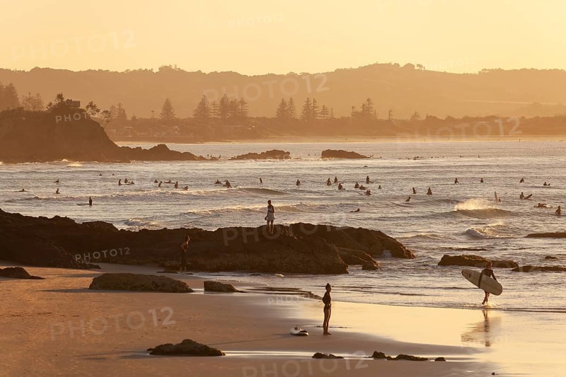 Fisherman Lookout, The Pass and surfers in the evening light of Byron Bay, New South Wales, Australia