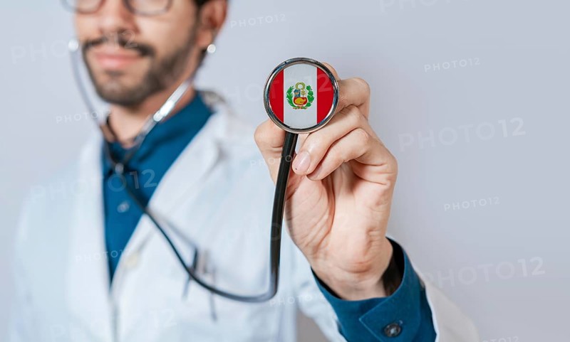 Doctor holding stethoscope with Peru flag. Peru health and care concept. Peru flag on stethoscope