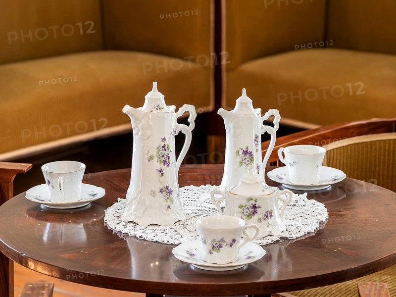 Vintage coffee service on the table, old porcelain