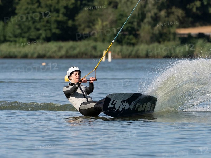 Young man with wakeboard, sporty on water, athletic model, active water sports, wake park
