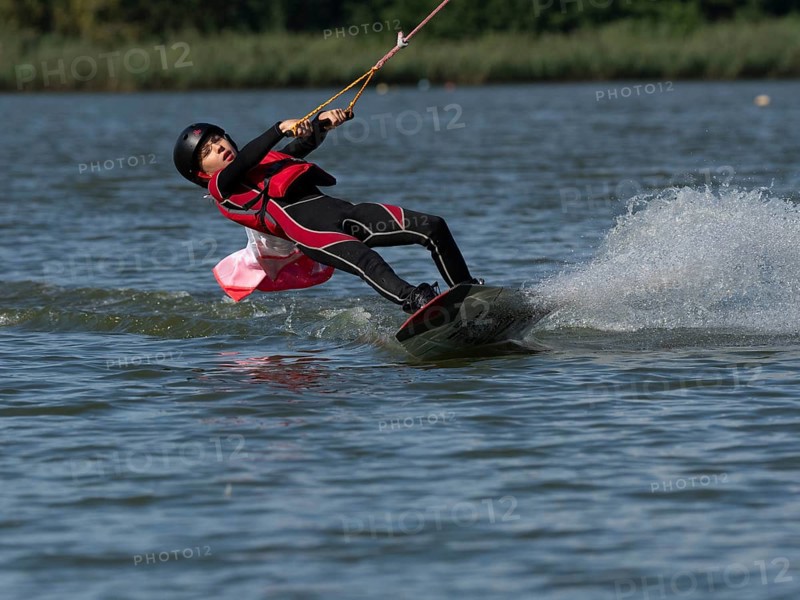 Boy or girl with wakeboard, sporty on the water, active water sports, wake park
