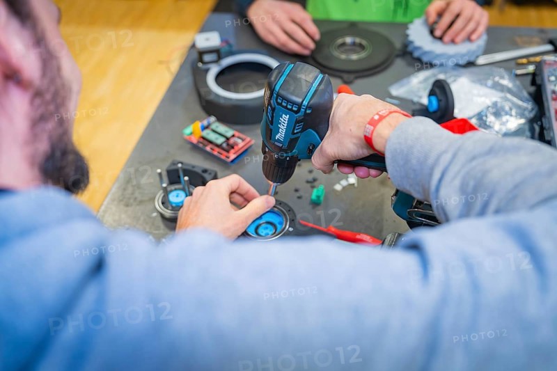 Two people use drills and work on electronic components, Jugend Forschungszentrum Nagold, Calw district, Germany