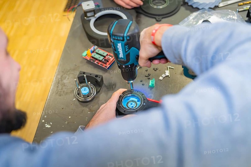 A person uses a drill in a workshop, Jugend Forschungszentrum Nagold, Calw district, Germany