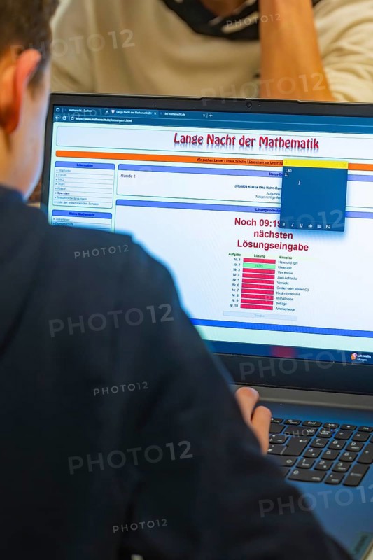 Young person looking at math problems on a laptop screen, Jugend Forschungszentrum Nagold, Calw district, Germany