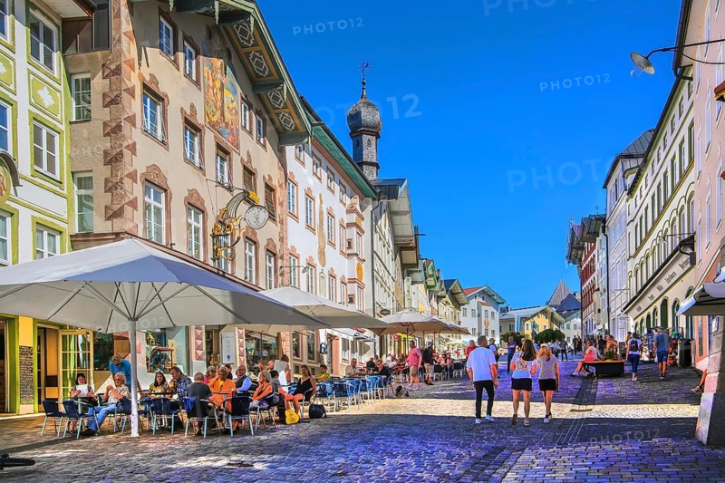 Historic market street with street cafe and typical gabled houses, Bad Tölz. Isartal, Upper Bavaria, Bavaria, Germany