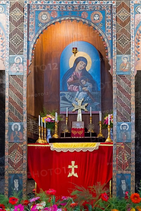 Religious altar with icon and candles richly decorated with flowers in a decorated wall niche, Sevanavank monastery, Sevan monastery, Gegharkunik province, Armenia