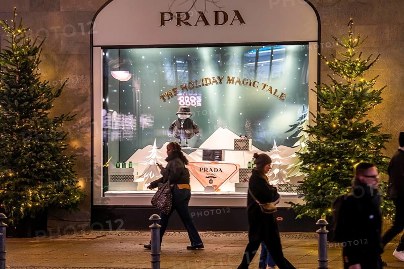 The KaDeWe, department store of the West on TauentzienstraÃŸe in Christmas light decoration, Prada shop window, Berlin, Germany