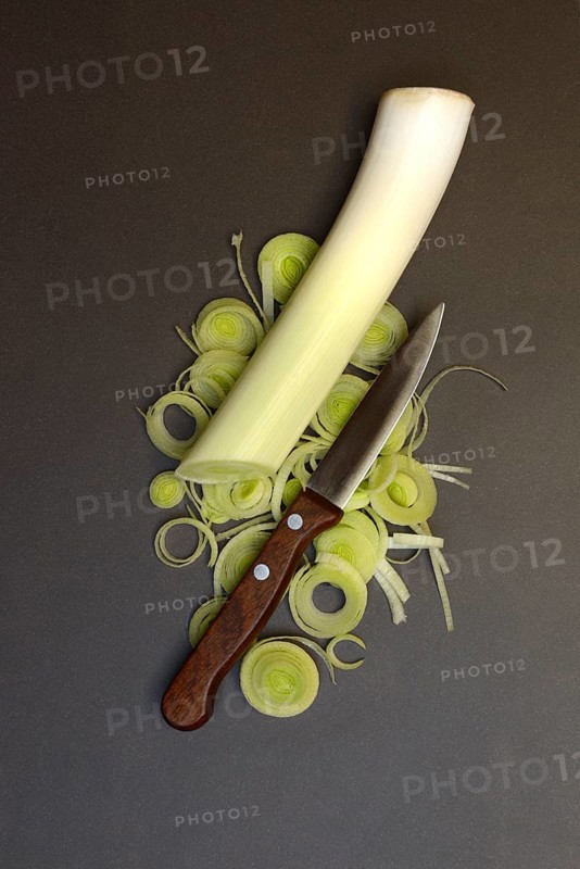 Leeks, leek rings with kitchen knife, sliced leek stalk, leek