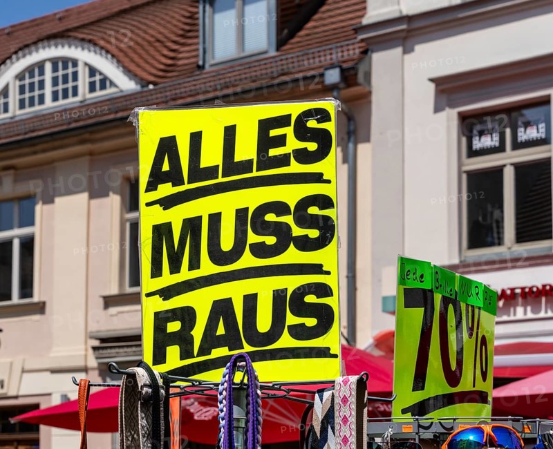 Retail trade with signs for price reductions and discounts, Potsdam, Brandenburg, Germany