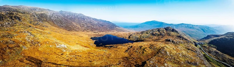 Autumn colours over Llyn Cwmffynnon and Miner's Track, Start Point, road A4086 from a drone, Pen-y-Pass, Snowdonia, Wales, UK