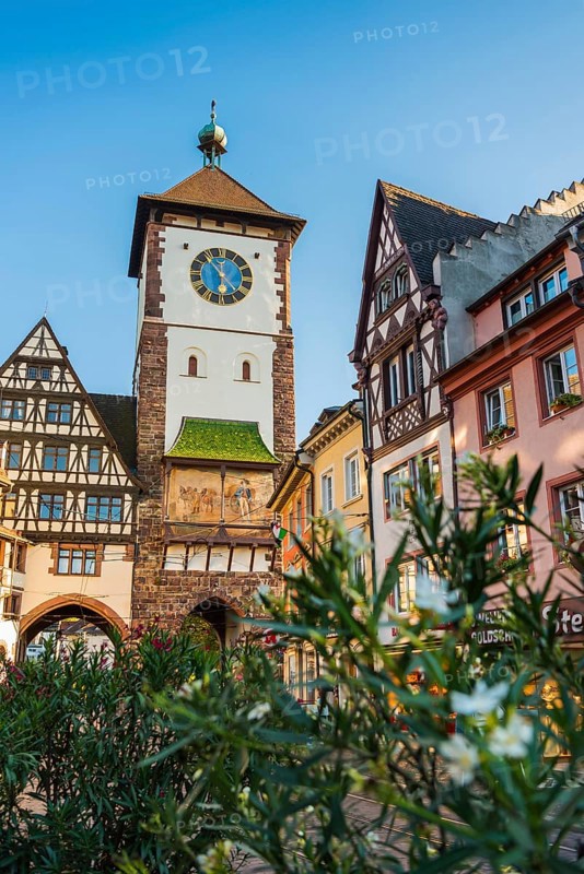 The historic Swabian Gate with flowers in the foreground, Freiburg im Breisgau