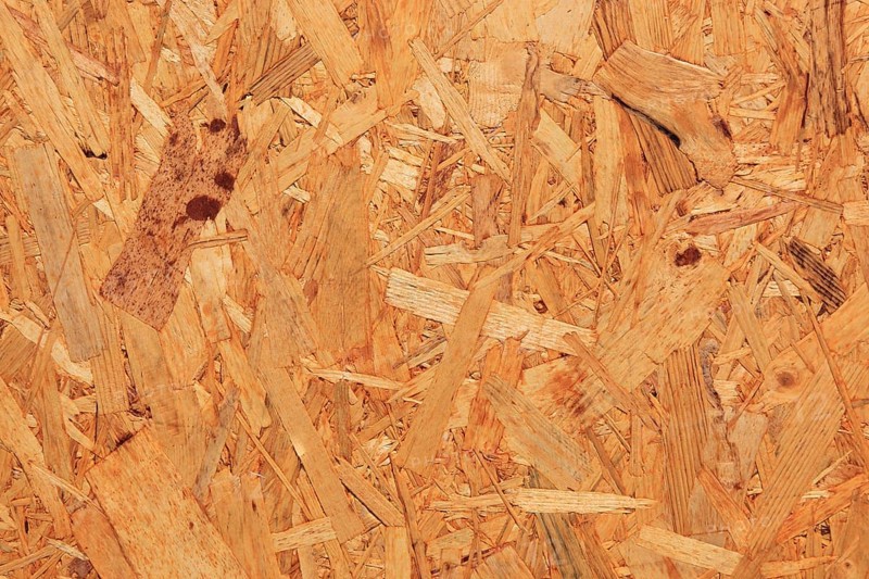 Particleboard made from wood fibers with a natural, coarser surface