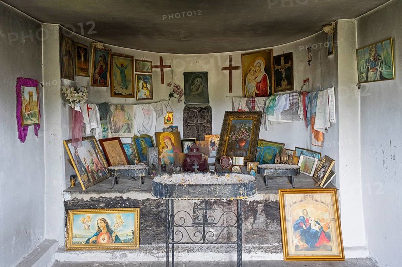 Interior view of an altar with religious icons and decorations on the walls, Holy Cross Chapel, Sarukhan, Lake Sevan, Gegharkunik Province, Armenia