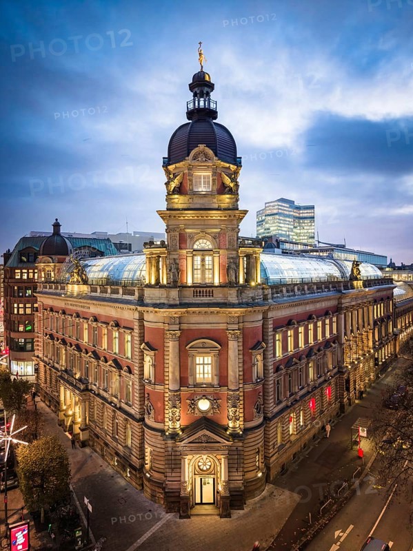 Aerial view of Old Oberpostdirektion am Stephansplatz during the blue hour with clouds in the background, Hamburg, Germany