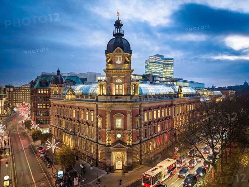 Aerial view of Old Oberpostdirektion am Stephansplatz during the blue hour with clouds in the background, Hamburg, Germany