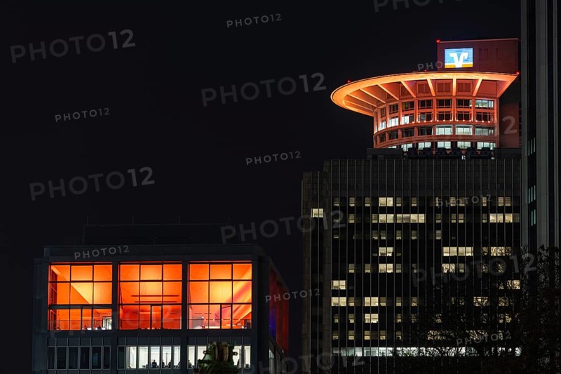 On the occasion of Orange Day, the international day against violence against woman on 25.11.2025, numerous buildings on the banking skyline in Frankfurt am Main were illuminated in orange, including the DZ Bank Tower, Frankfurt am Main, Hesse, Germany Germany