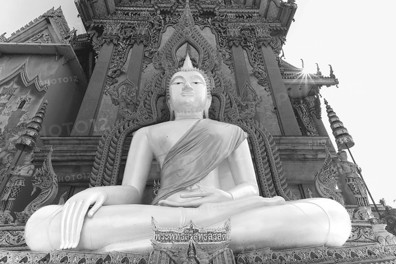 Buddha statue with tunic, Bhumispara mudra, Buddha Gautama at the moment of enlightenment, at the entrance to Wat Sitthawararam, Bangkok, Thailand