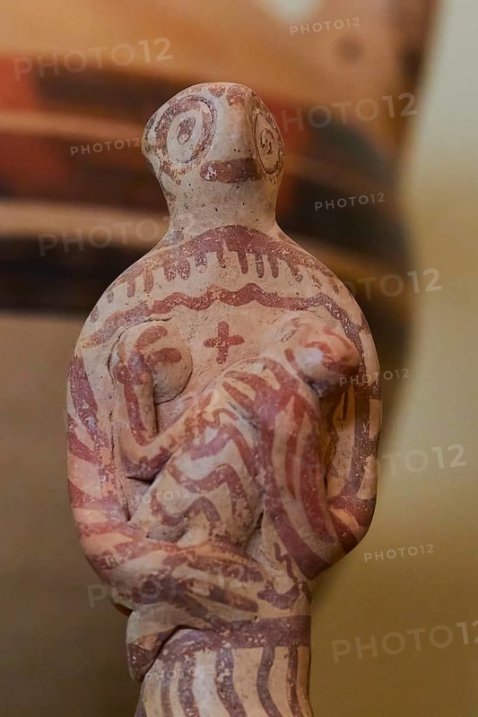 Female ceramic figure caring for a baby or toddler, 1500 century BC Archaeological Museum, Nemea, Peloponnese, Greece