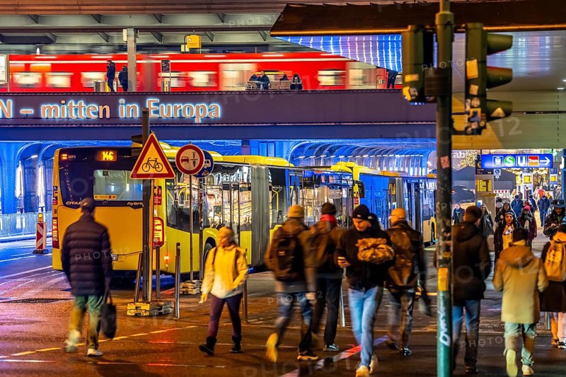 The main train station in Essen, blue illuminated underpass, bus station, am Europaplatz, train on the platform, pedestrian crossing, North Rhine-Westphalia, Germany