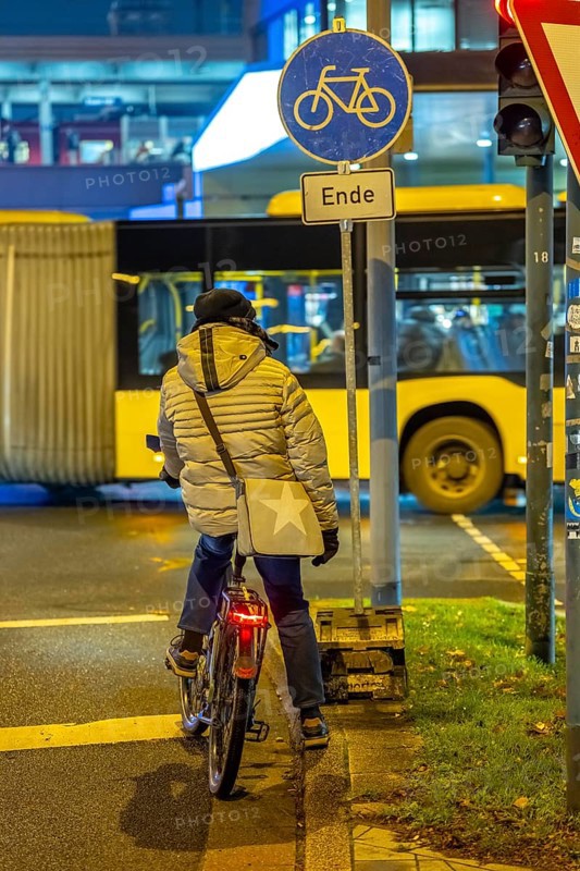 The main train station in Essen, bus station, Europaplatz, pedestrian crossing, traffic light, cyclists waiting at red, North Rhine-Westphalia, Germany