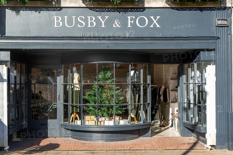 Shopfront window display Busby & Fox shop store, Cathedral Yard, Exeter city centre, Devon, England, UK