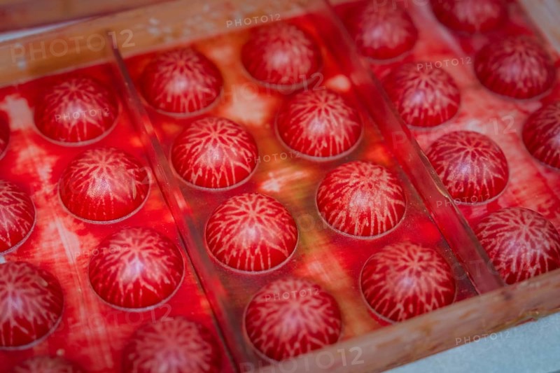 Close-up of red balls with white structures in a mold, Christmas baking, Haselstaller Hof, Wildberg, Calw district, Germany