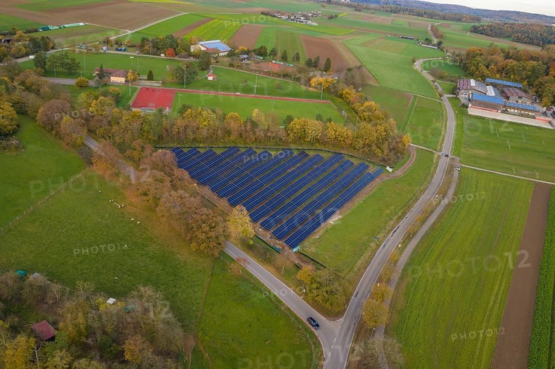 Solar system nestled in a green landscape with roads and fields in autumn, construction of PV open-air system, Weil der Stadt, Germany