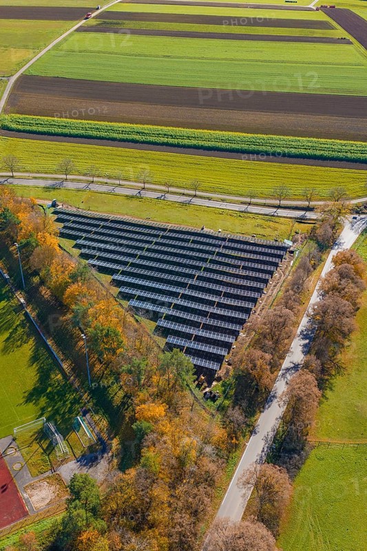 Solar system, nestled in autumnal nature and fields from a bird's eye view, Bau PV Freifaechenanlage, Weil der Stadt, Germany
