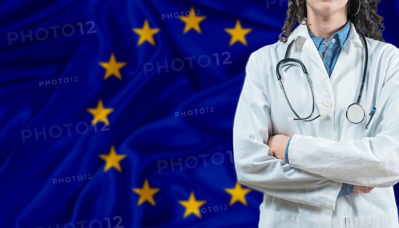Medical professional on European Union flag. Healthcare and wellness in European Union, Concept