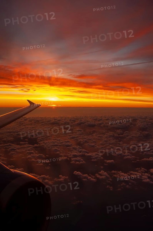 View from airplane window at sunrise