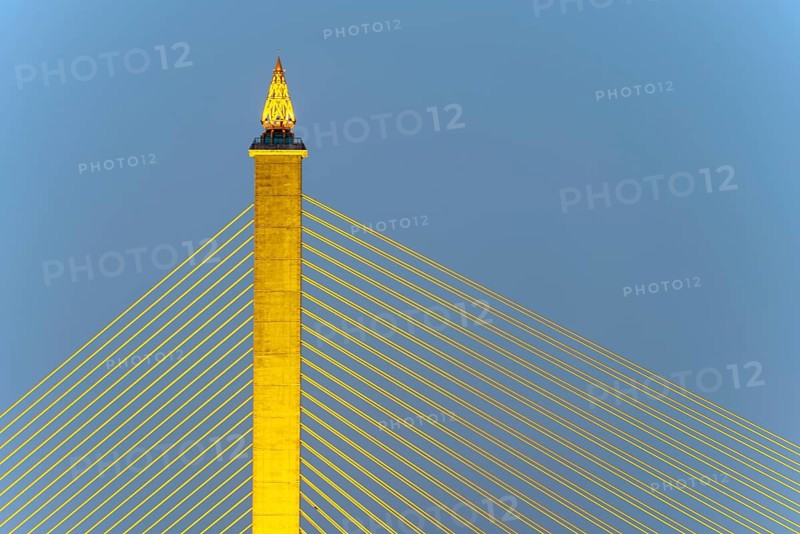 The illuminated Rama VIII Bridge, a cable-stayed bridge across Mae Nam Chao Praya, Bangkok, Thailand