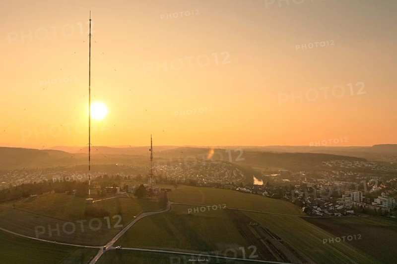 An idyllic sunset over vast fields with a dominant transmission tower, MÃ¼hlacker, Enzkreis, Germany