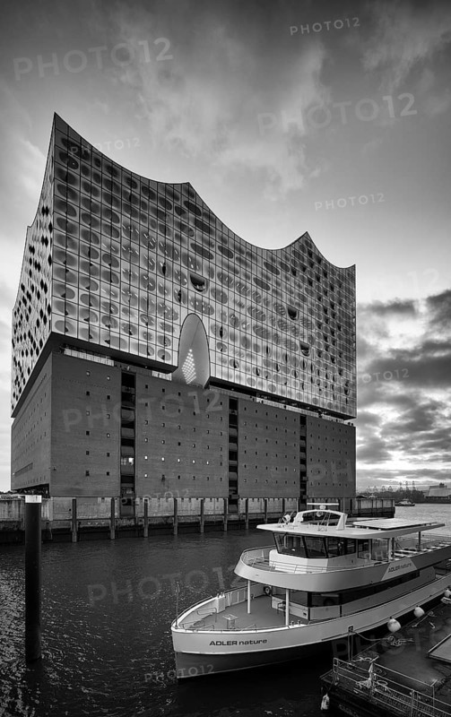 Excursion boat in front of the glass faÃ§ade of the Elbe Philharmonic Hall, Elphie, Free and Hanseatic City of Hamburg, black and white, Germany