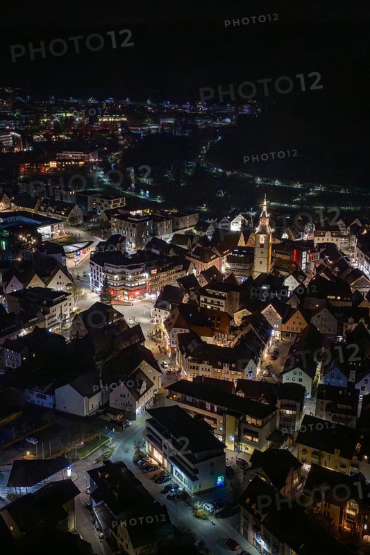 Panoramic view of a city at night with a brightly lit church tower, Nagold, Calw district, Germany