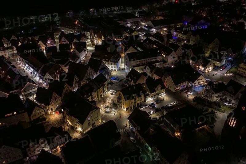 Extensive city view at night with illuminated houses, Nagold, Calw district, Germany