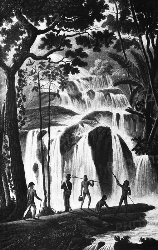 Waterfall in New Ireland, formerly Neumecklenburg, today New Guinea, Micronesia archipelago, Pacific Ocean, rainforest, inner tropics, tropical climate, local fish, long staff with fork, colonial owner, travel, historical illustration around 1900