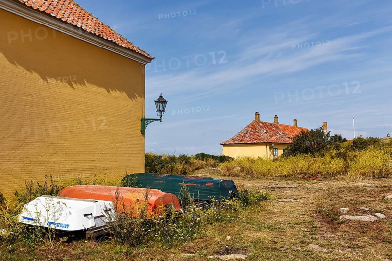 Rural coastal landscape, traditional buildings, state prison for political prisoners, three boats, Cirrus, FrederiksÃ¶, Ertholmene, Pea Islands, Bornholm, Denmark