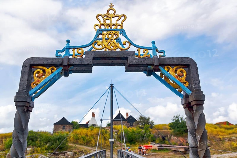 Pedestrian bridge between ChristiansÃ¸ and FrederiksÃ¸, Christiansö and Frederiksö, decorative gate with crown and monogram of King Christian VII, Ertholmene, Pea Islands, Bornholm, Denmark