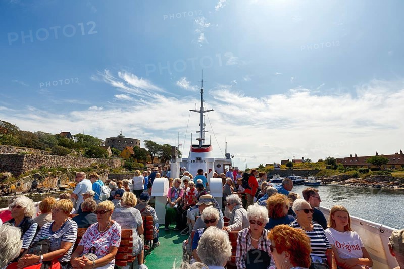 Group of tourists on ferry Ertholm, Danish passenger ship to Gutjem, ChristiansÃ¸, Christiansö, Ertholmene, Pea Islands, Bornholm, Denmark