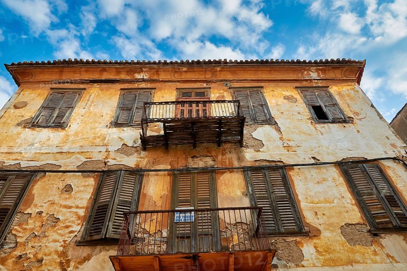 Old town of Nauplion, weathered faÃ§ade of an old building with balconies, under a clear sky, Nauplion, Nafplion, Peloponnese, Greece